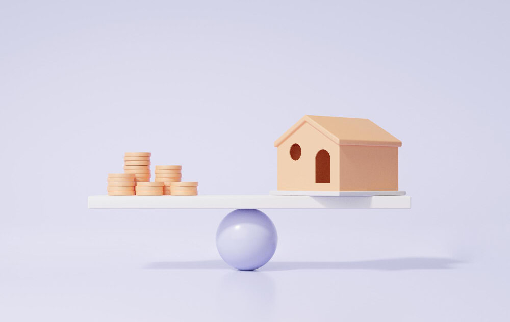 wooden house and coins balancing